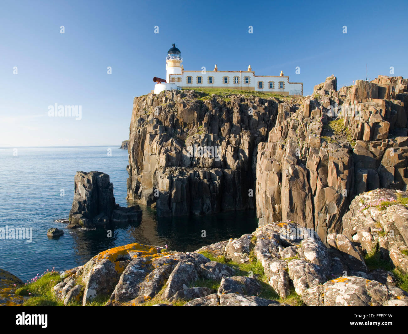 Glendale, Isle of Skye, Highland, Scotland. View from rocky headland to the clifftop lighthouse