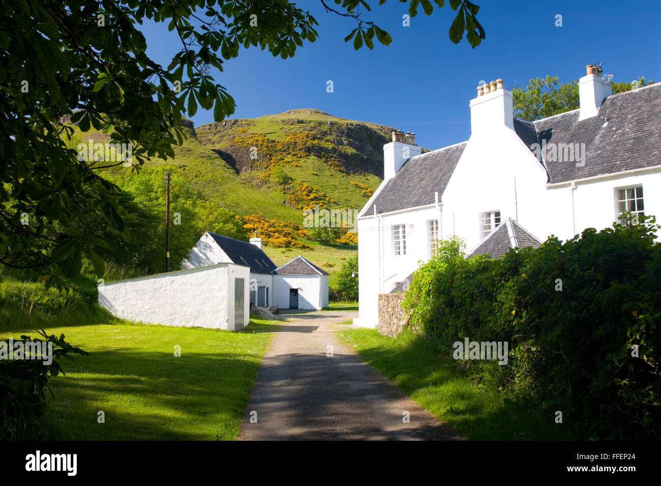Carbost, Isle of Skye, Highland, Scotland. View along picturesque footpath beside historic Talisker House. Stock Photo