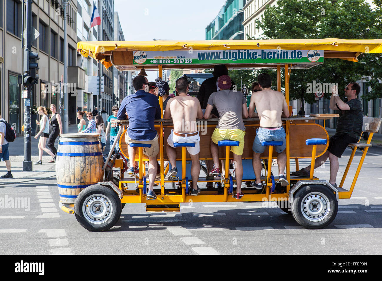 big bike Berlin with men drinking beer Stock Photo