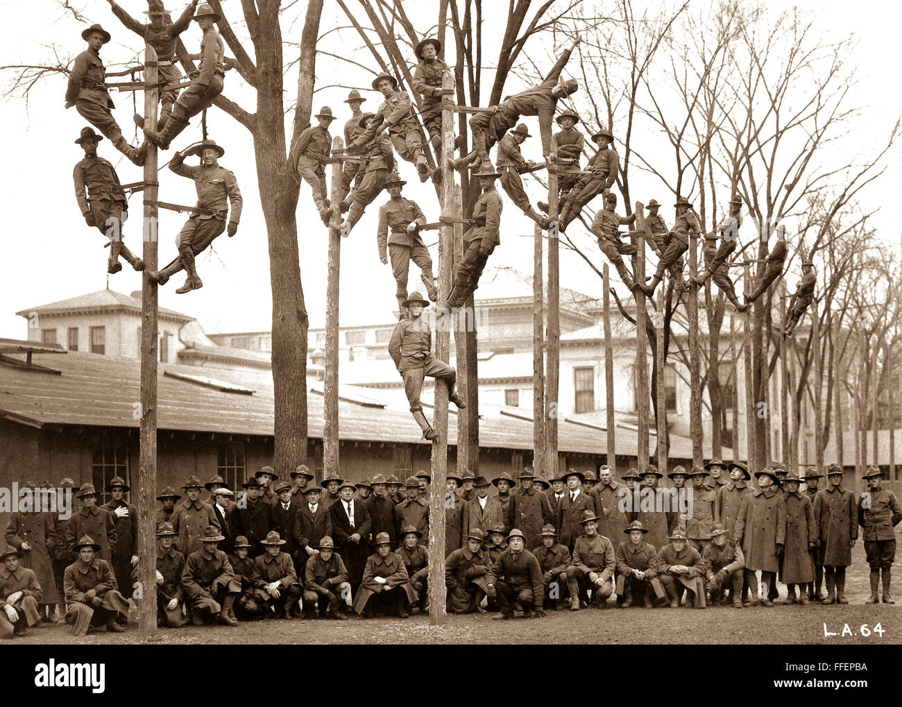 Vocational training for S.A.T.C. in University of Michigan, Ann Arbor.  Class in Pole-Climbing in the course for telelphone electricians, with some of their instructors.  Ca.  1918.    This archival print is available in the following sizes:    8' x 10'   $15.95 w/ FREE SHIPPING  11' x 14' $23.95 w/ FREE SHIPPING  16' x 20' $59.95 w/ FREE SHIPPING  20' x 24' $99.95 w/ FREE SHIPPING    * The American Photoarchive watermark will not appear on your print. Stock Photo