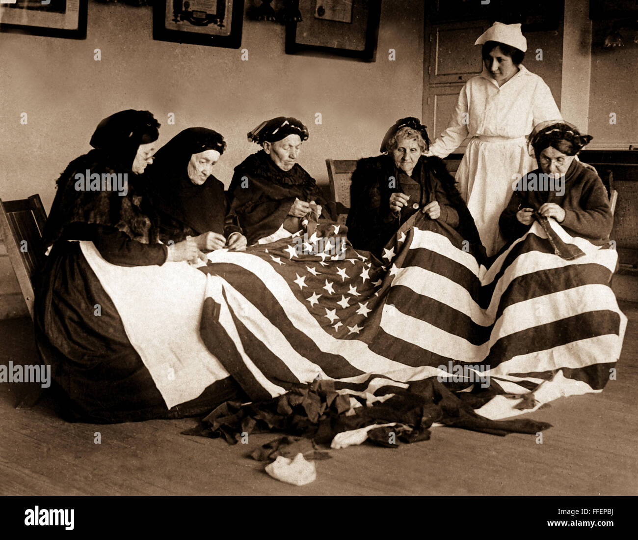 Patriotic old women make flags.  Born in Hungary, Galicia, Russia, Germany, Rumania.  Their flag-making instructor, Rose Radin, is standing.  Ca. 1918.    This archival print is available in the following sizes:    8" x 10"   $15.95 w/ FREE SHIPPING  11" x 14" $23.95 w/ FREE SHIPPING  16" x 20" $59.95 w/ FREE SHIPPING  20" x 24" $99.95 w/ FREE SHIPPING    * The American Photoarchive watermark will not appear on your print. Stock Photo