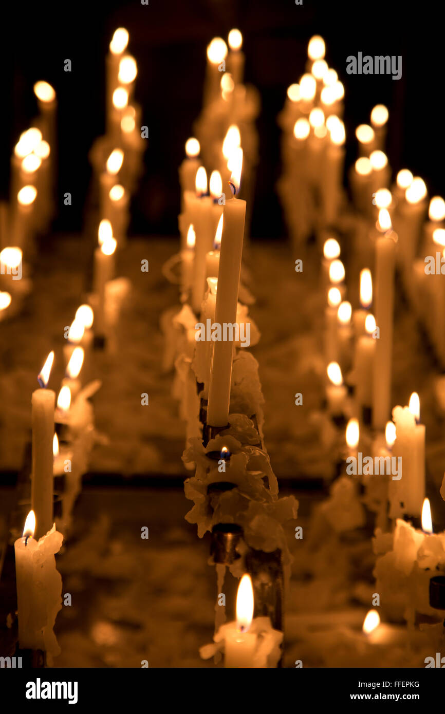 Praying candles in the Bozen cathedral Stock Photo Alamy