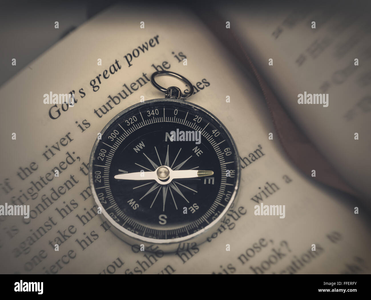 Bible with compass Stock Photo