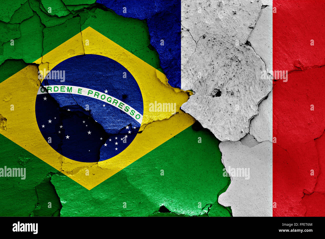 flags of Brazil and France painted on cracked wall Stock Photo