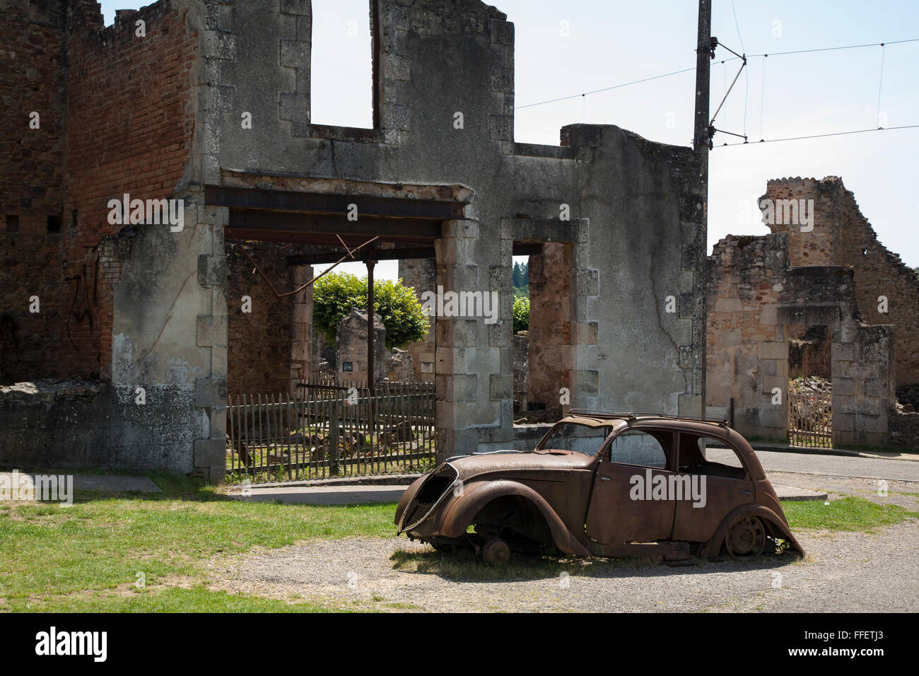 Rusting abandoned cars in village of Oradour sur Glane, Haute Vienne, France Stock Photo