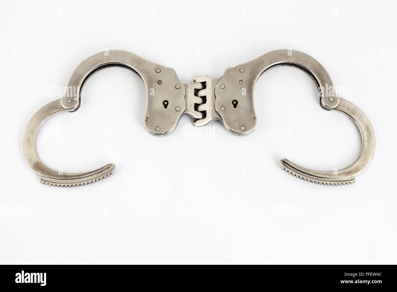 open handcuffs with white background Stock Photo Alamy
