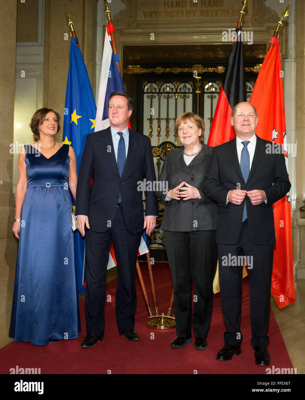 Hamburg, Germany. 12th Feb, 2016. Chancellor Angela Merkel (CDU, 2nd r), British Premier David Cameron (2nd l), Mayor of Hamburg Olaf Scholz (SPD, r) and his wife Britta Ernst (l) together at the city hall of Hamburg, Germany, 12 February 2016. Merkel and Cameron are guests of honour at the oldest feast in the world. Since 1356, the governance of the Hanse city invites to the Matthiae dinner. PHOTO: CHRISTIAN CHARISIUS/dpa/Alamy Live News Stock Photo