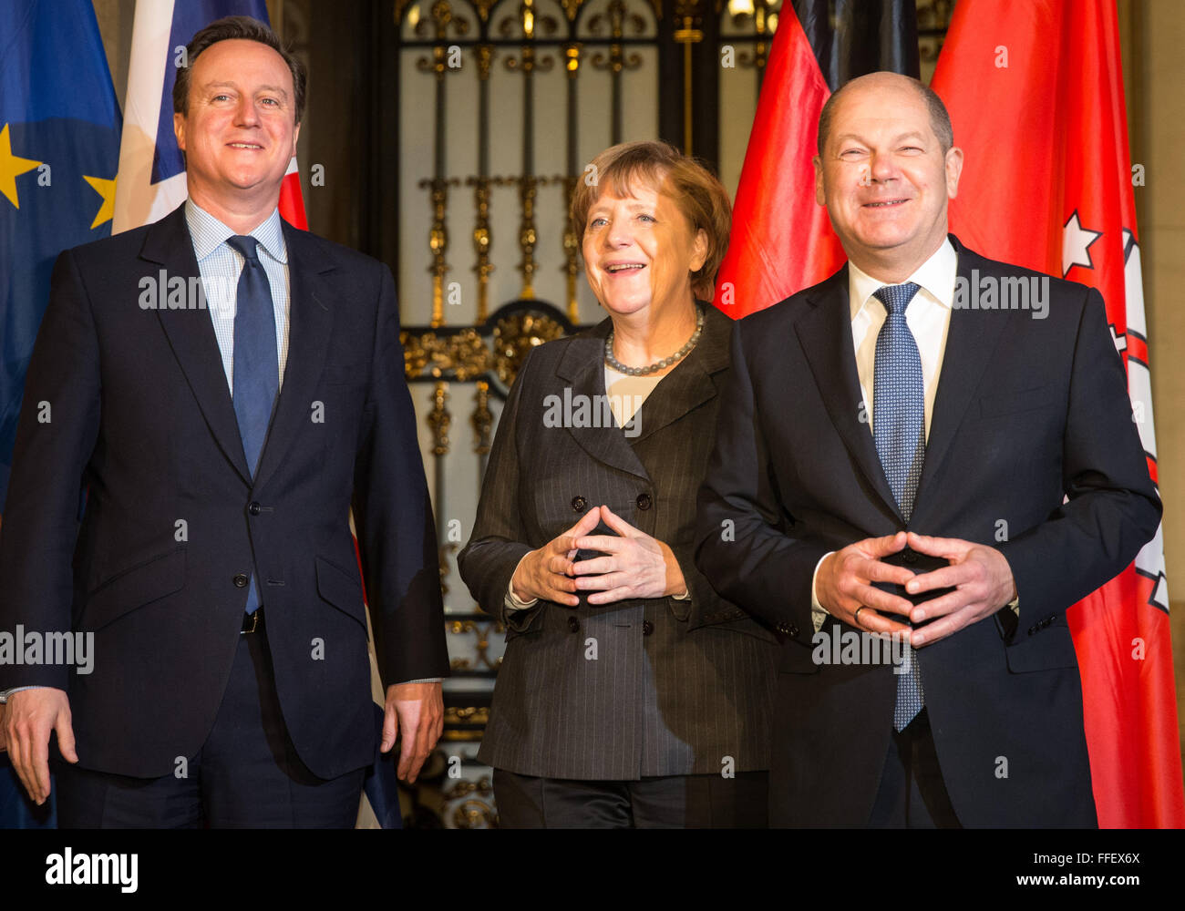 Hamburg, Germany. 12th Feb, 2016. British Premier David Cameron (l-r), Chancellor Angela Merkel (CDU) and Mayor of Hamburg Olaf Scholz (SPD) together at the city hall of Hamburg, Germany, 12 February 2016. Merkel and Cameron are guests of honour at the oldest feast in the world. Since 1356, the governance of the Hanse city invites to the Matthiae dinner. PHOTO: CHRISTIAN CHARISIUS/dpa/Alamy Live News Stock Photo