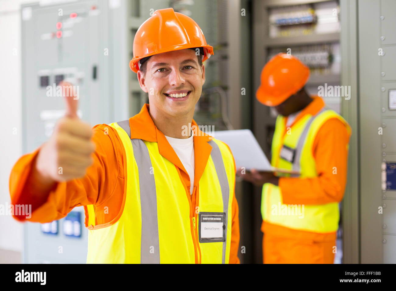 cheerful control room electrical engineer thumb up Stock Photo