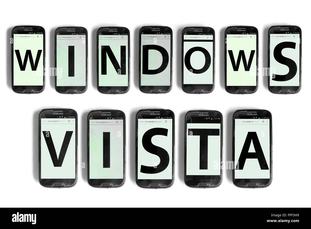 Windows Vista written on the screens of smartphones photographed against a white background. Stock Photo