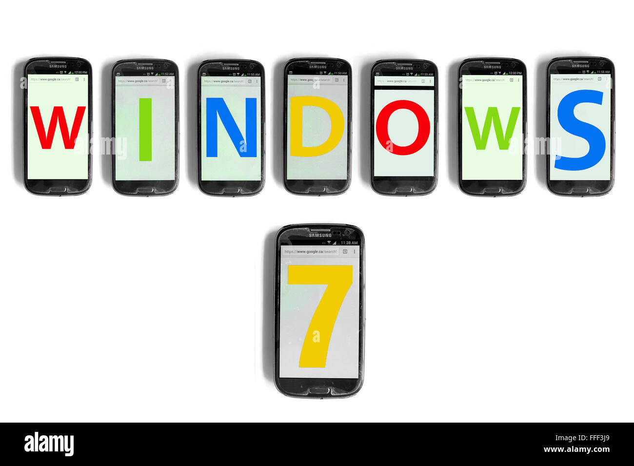 Windows 7 written on the screens of smartphones photographed against a white background. Stock Photo