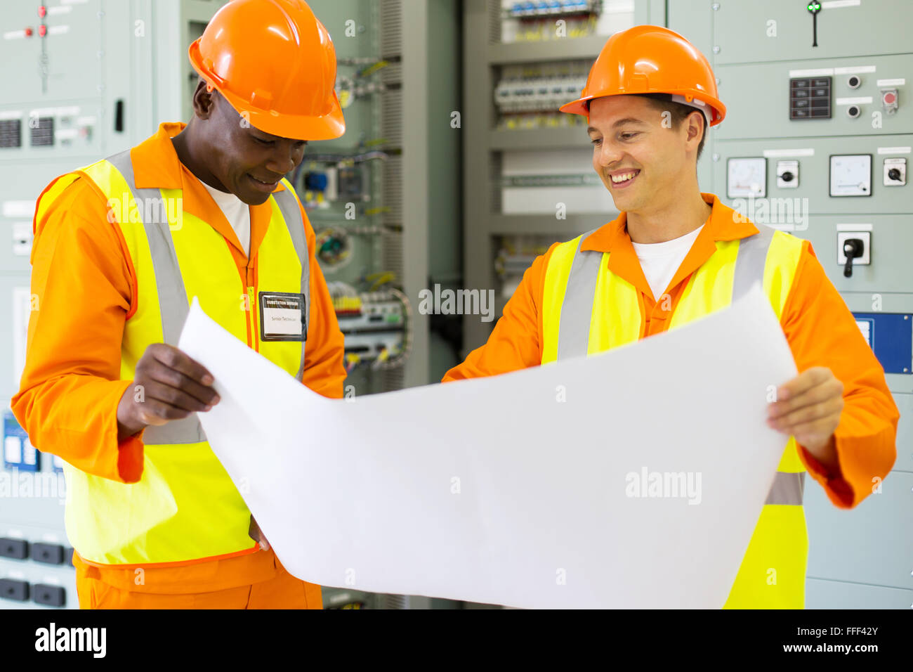 professional industrial engineers working in control room Stock Photo