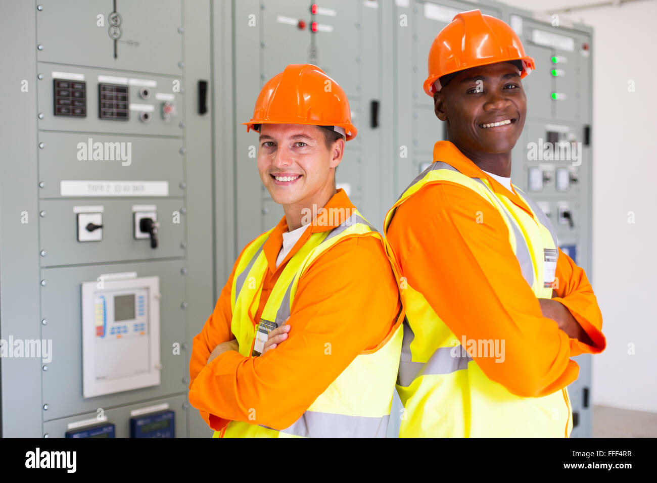 handsome young industrial engineers with arms crossed Stock Photo