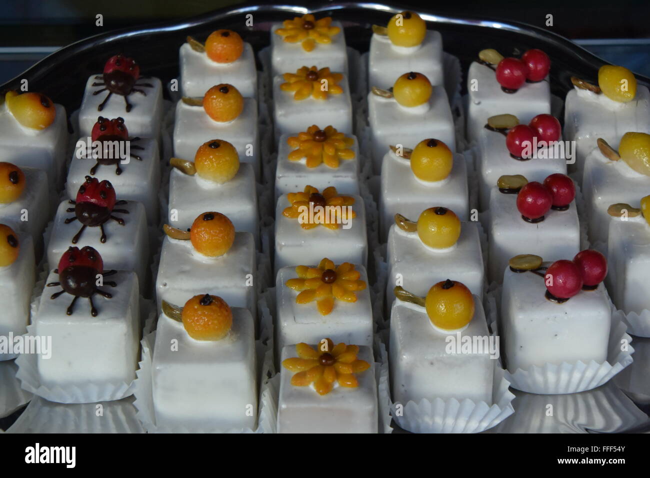 French 'Petit Four' cakes on a plate Stock Photo