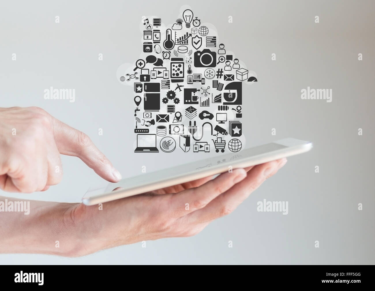 Hands holding tablet with smart home automation concept Stock Photo