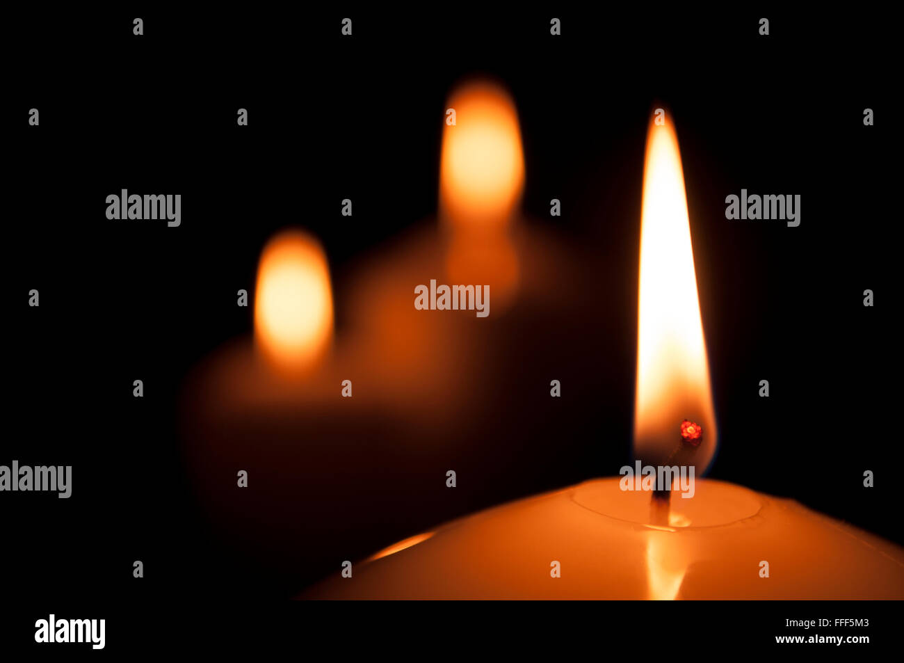 calm, bright, can be romantic or festive light candles on a black