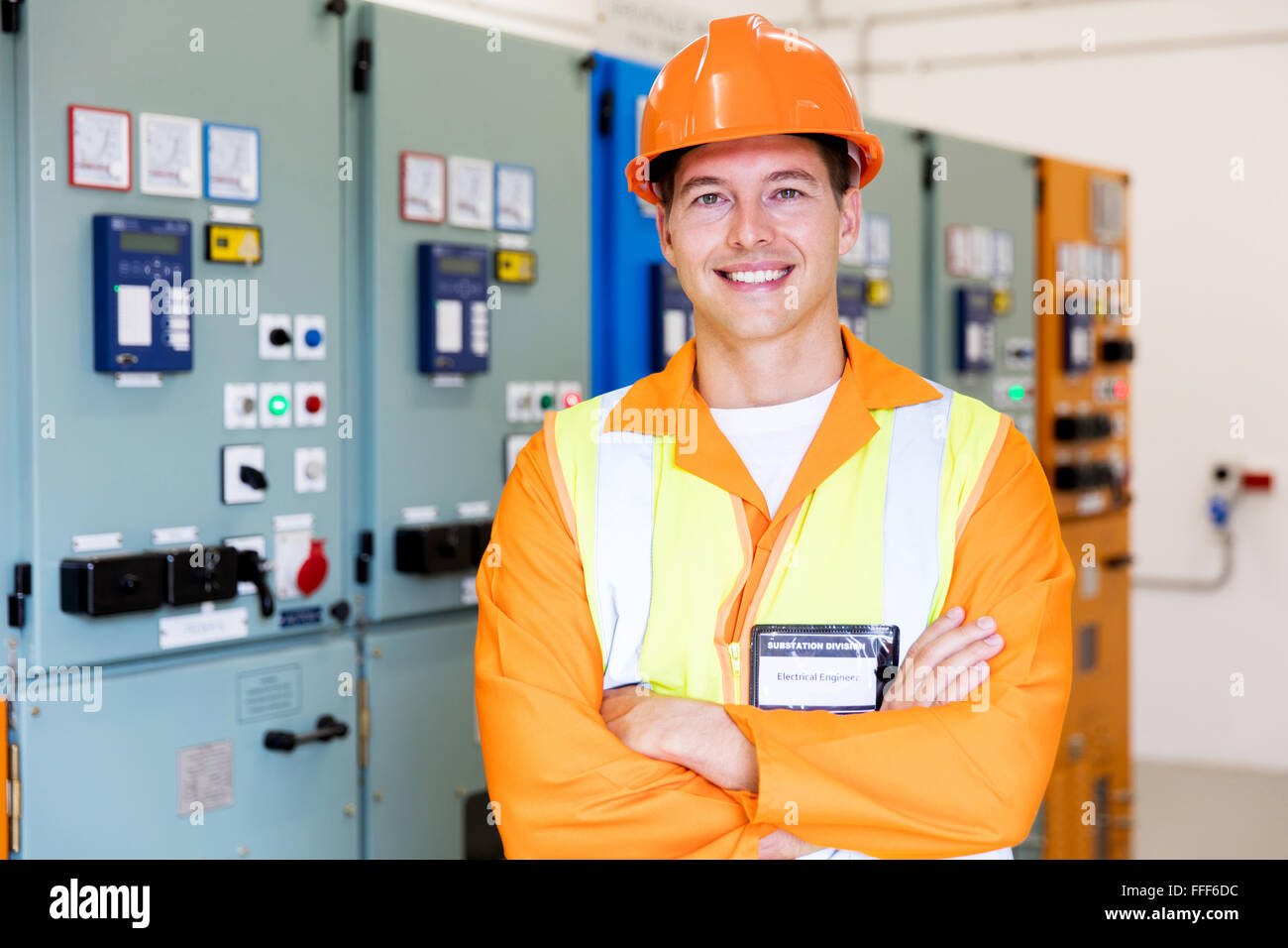 handsome industrial technician in front of control panel Stock Photo