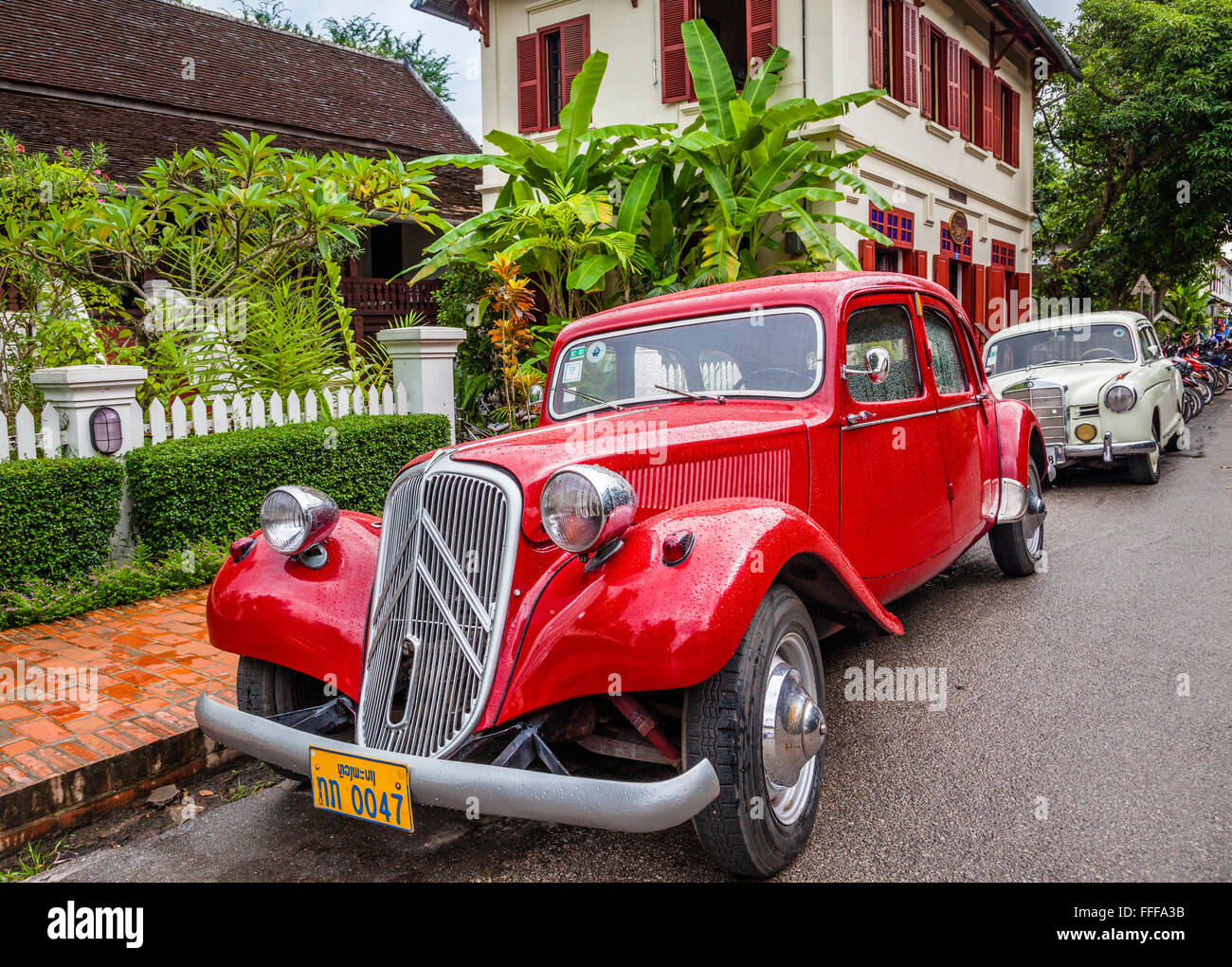 Lao People's Democratic Republic, Luang Prabang, vintage Citroen Traction Avant and a 1950s Mercedes Benz at Sakkaline Road Stock Photo