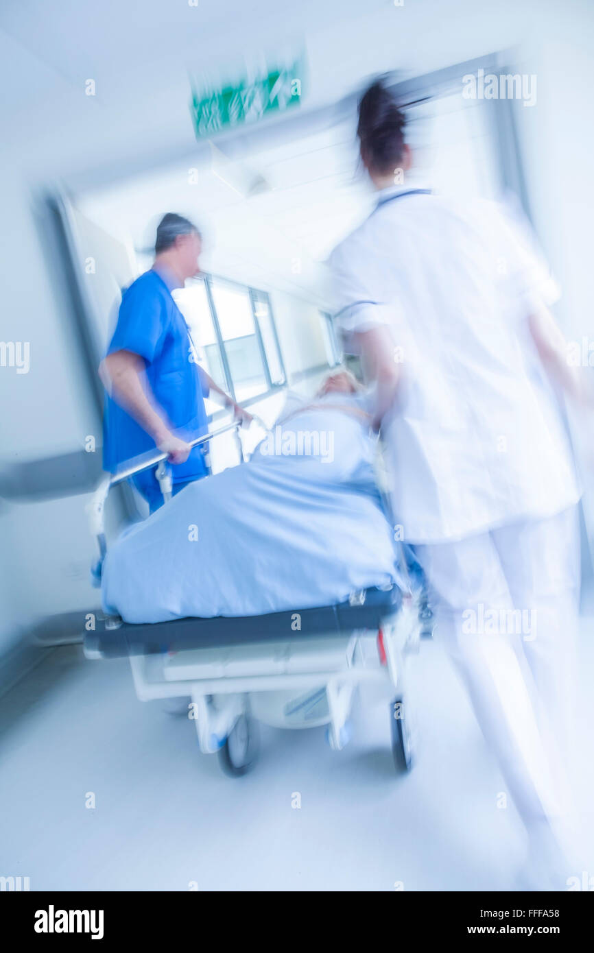 Hospital patient on gurney being hires stock photography and images