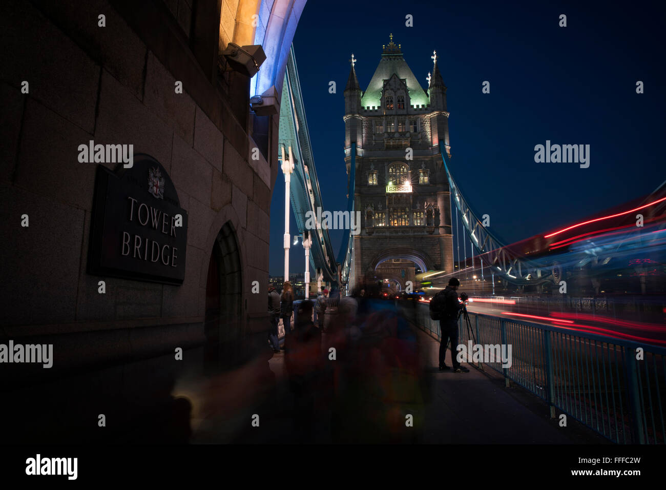 Photographer taking photos on Tower Bridge in London Stock Photo