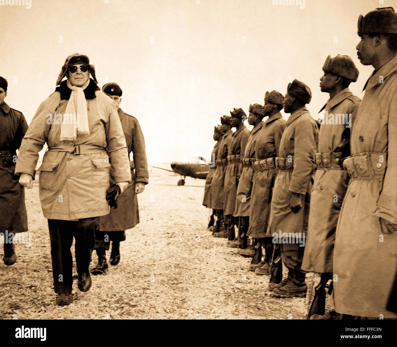 General of the Army Douglas MacArthur is shown inspecting troops of the 24th Inf. on his arrival at Kimpo airfield for a tour of the battlefront.  February 21, 1951. Stock Photo