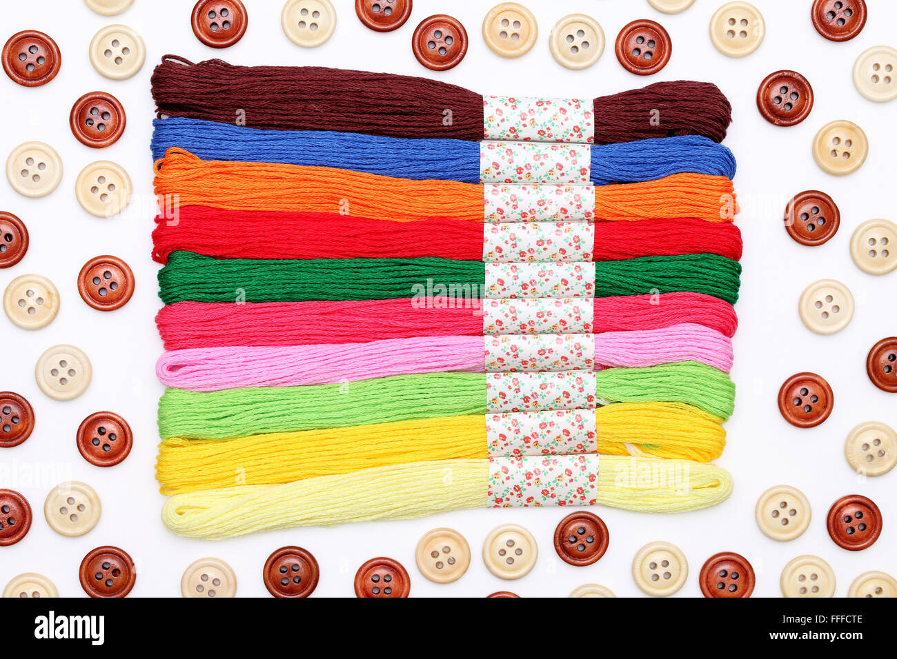 sewing buttons and threads on white background Stock Photo Alamy