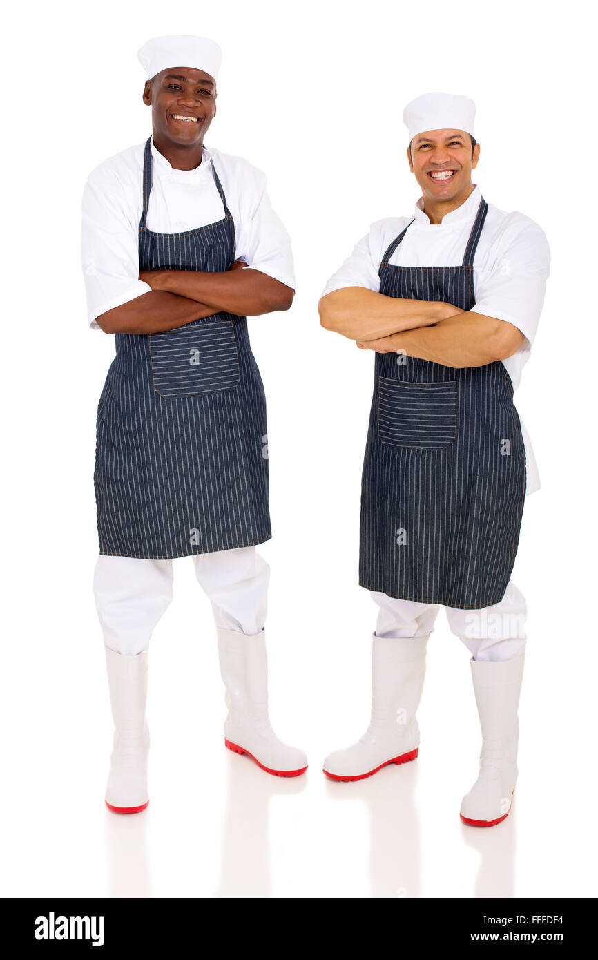 cheerful butchers with arms folded on white background Stock Photo