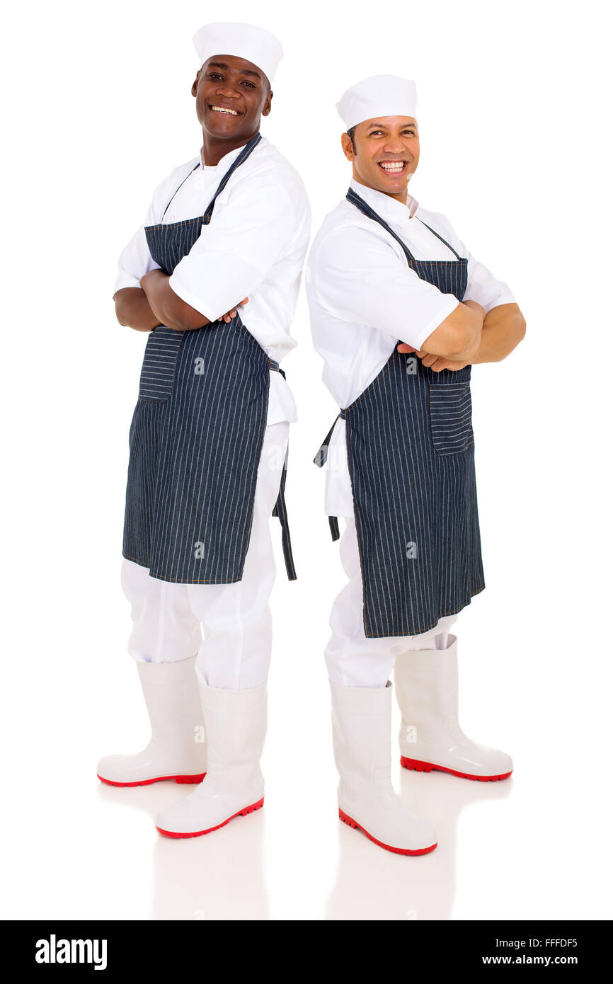 confident butchers standing back to back isolated on white background Stock Photo