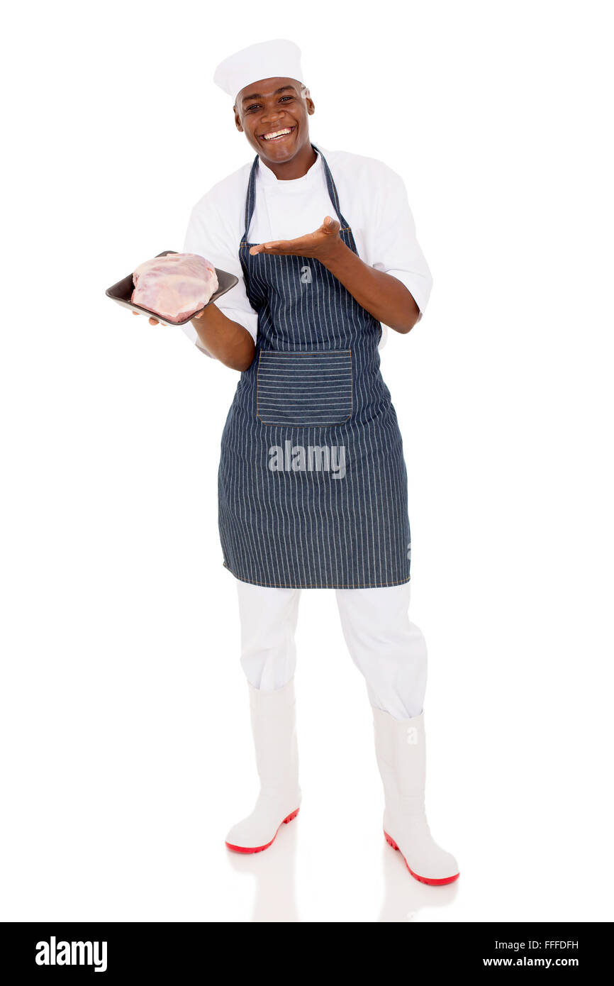 happy young African butcher presenting quality meat on white background
