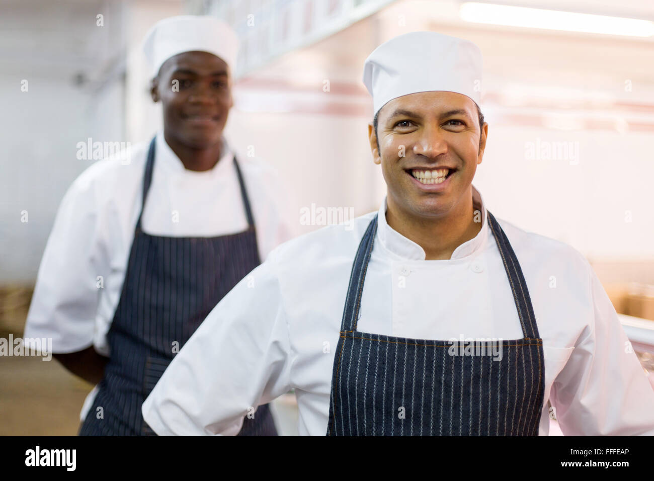 happy middle aged butchery owner and worker Stock Photo