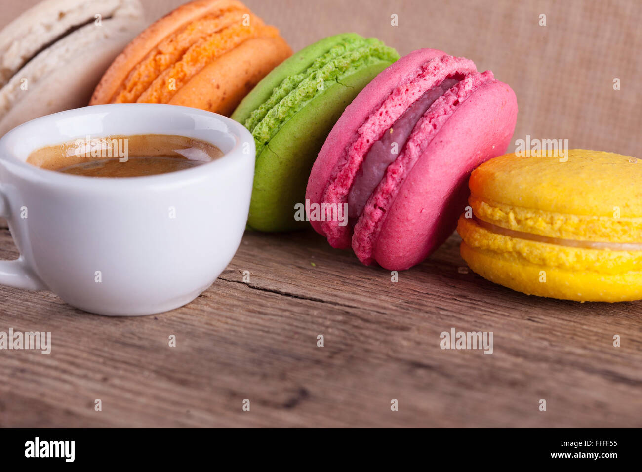 lot of macaroons and cup coffee vintage top view background Stock Photo