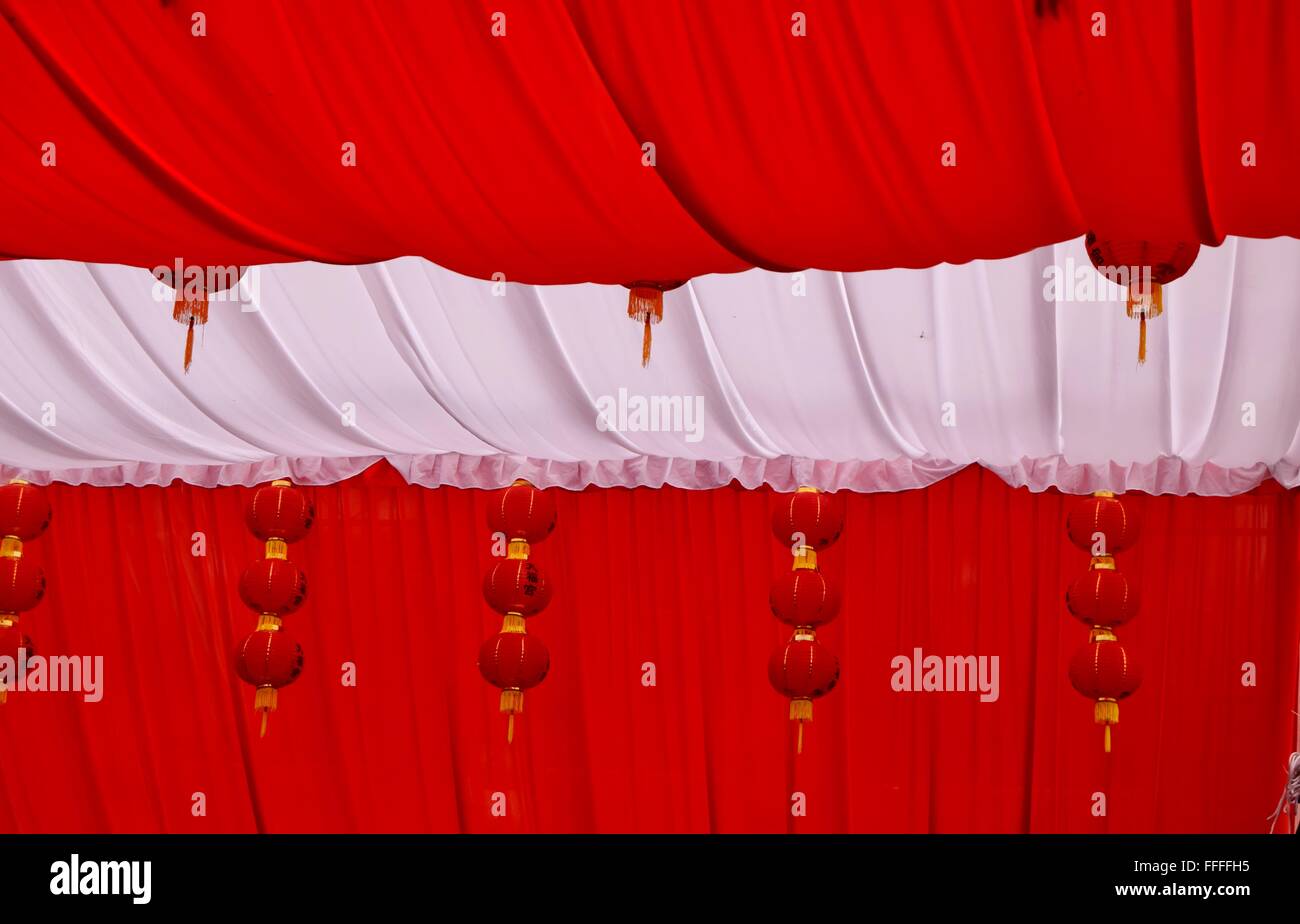 Red And White Tent Hanging With Red Lanterns Decorating The