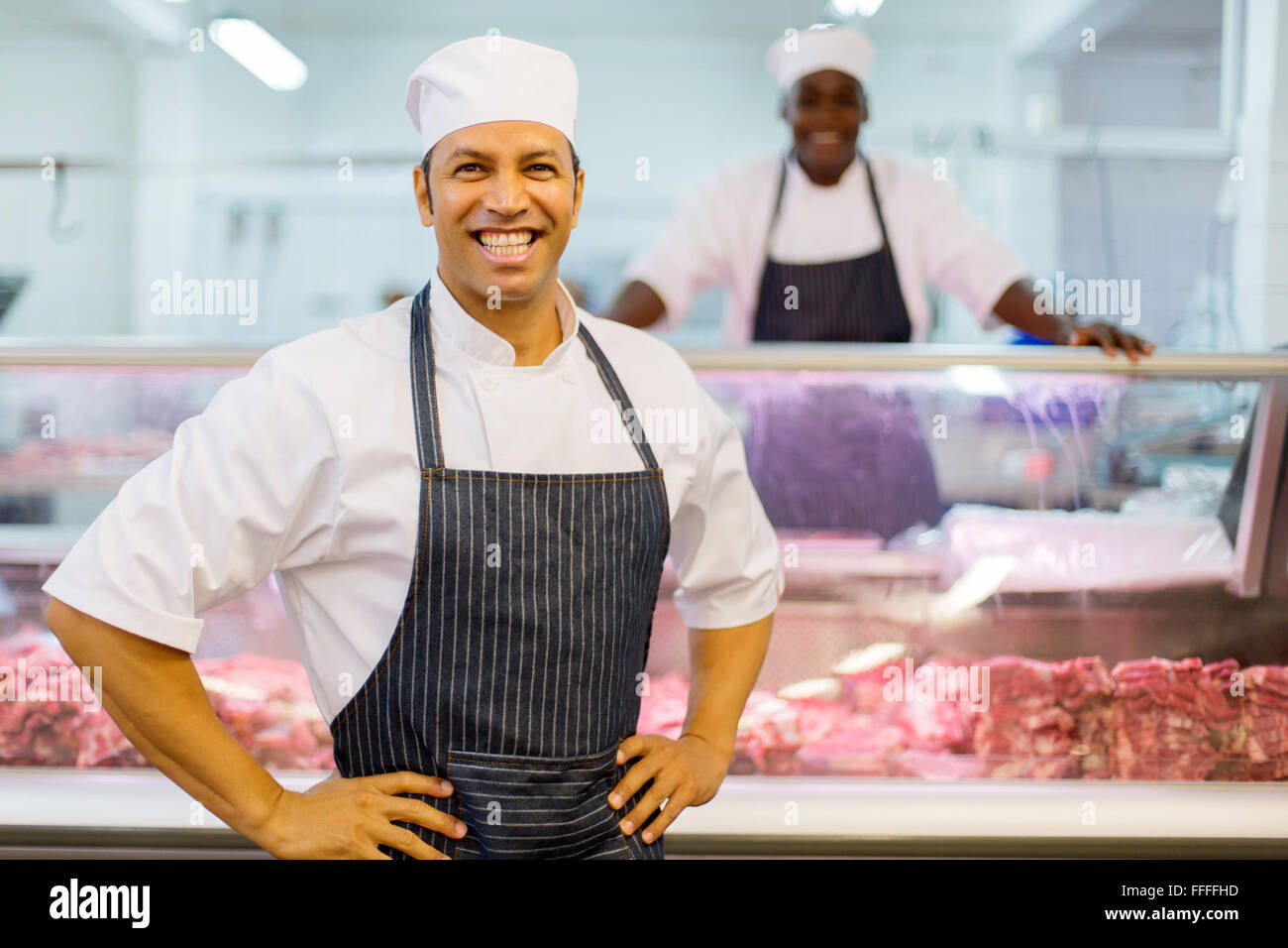 smiling male butchery owner in the shop Stock Photo
