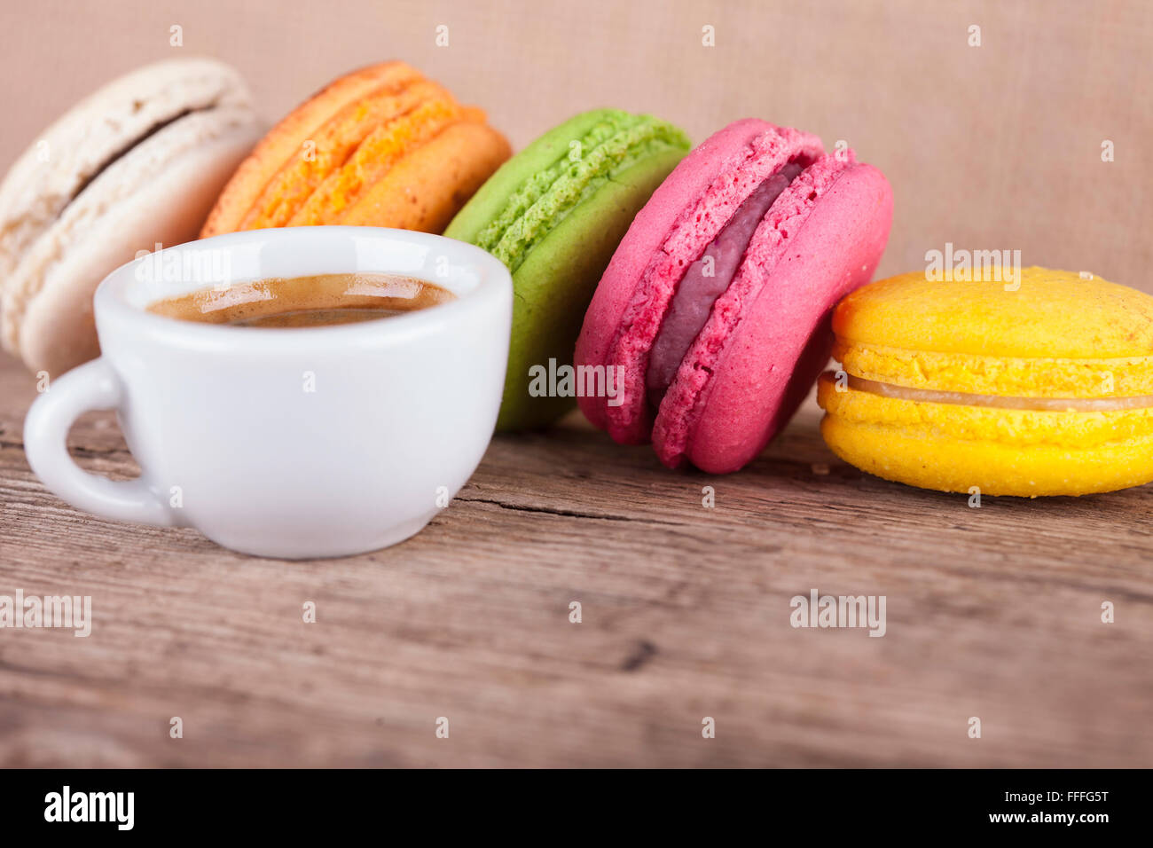 lot of macaroons and cup coffee vintage side view background Stock Photo
