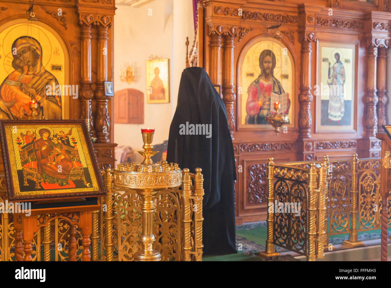 Orthodox church interior during Divine service, Convent of Nativity of Holy Virgin, Rostov, Yaroslavl region, Russia Stock Photo