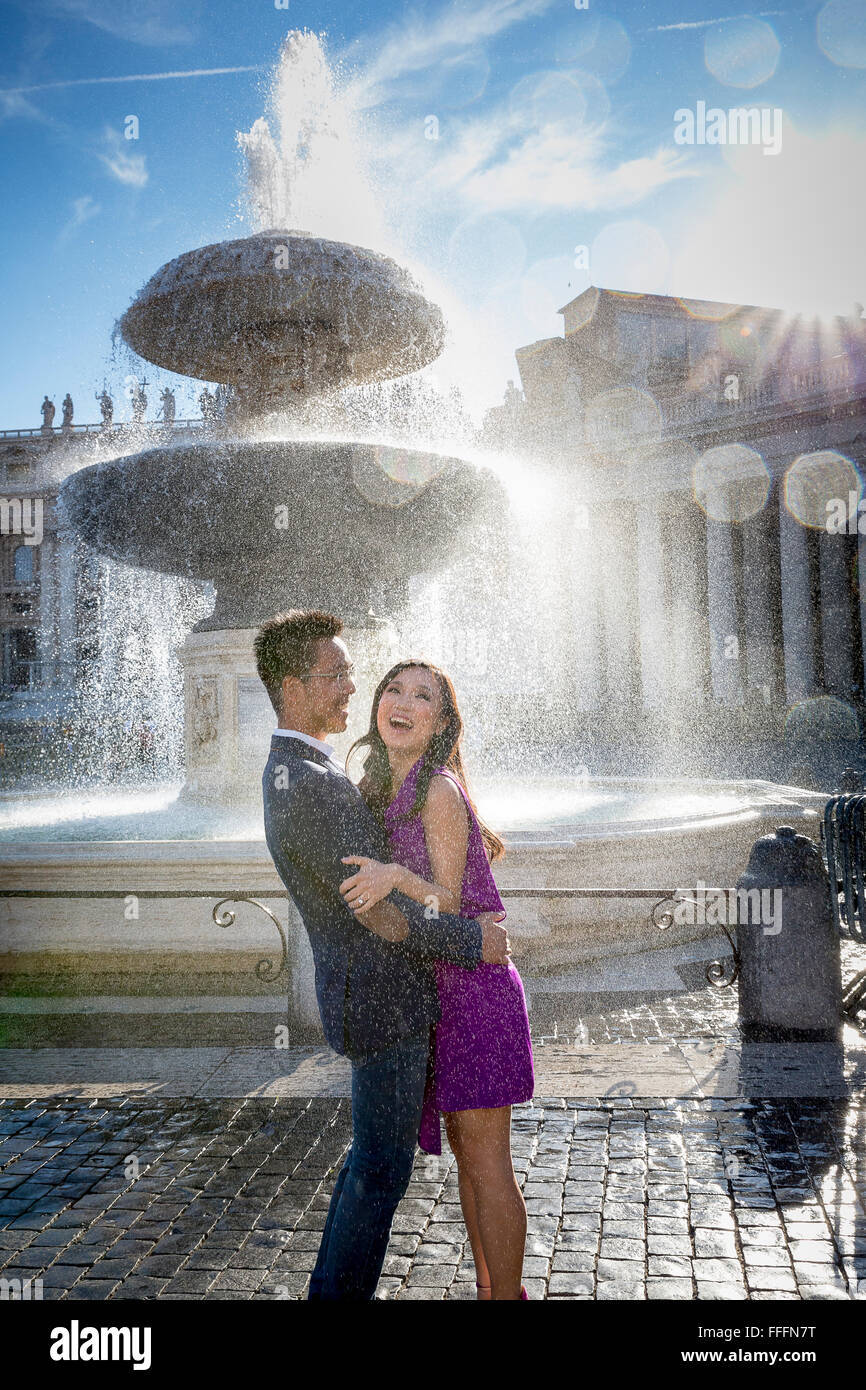 Couple at Piazza San Pietro with fountain. Stock Photo