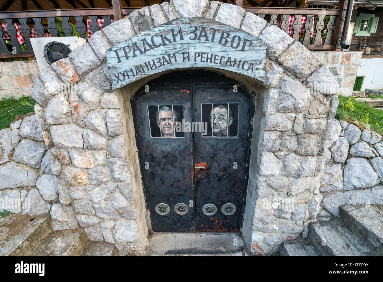 Prison 'City Jail - Humanism and renaissance' with George W. Bush and Javier Solana portraits in Drvengrad village, Serbia Stock Photo