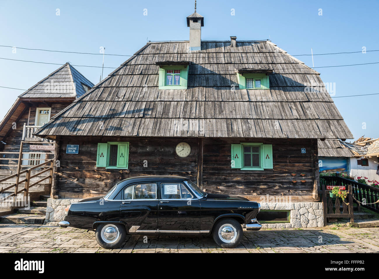 GAZ M21 Volga car (Third Series) in front of Main House of Drvengrad village (Kustendorf) built by Emir Kusturica, Serbia Stock Photo