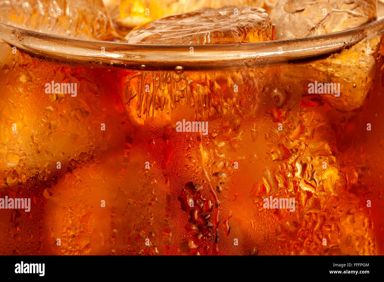 Closeup of cola with ice cubes in the glass. Stock Photo