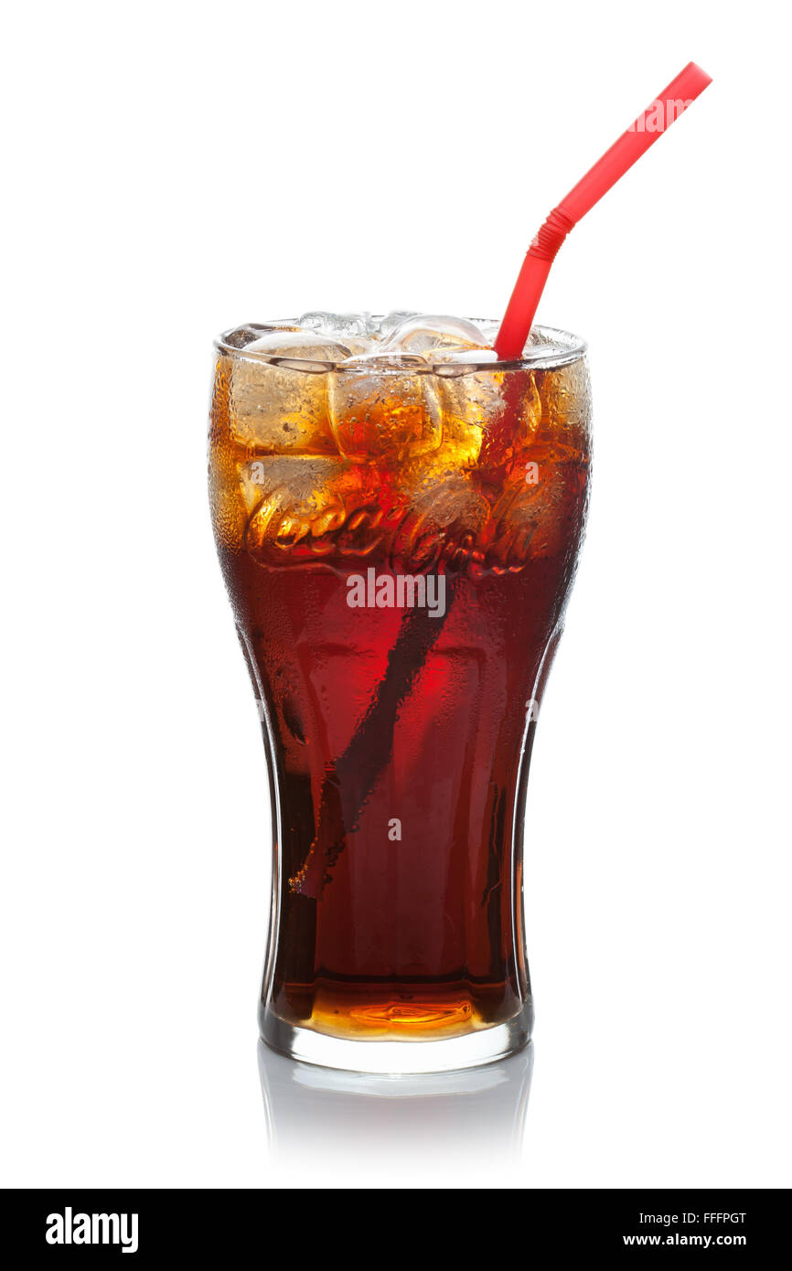 Coca-Cola with ice cubes and straw in a glass, isolated on the white background. Stock Photo