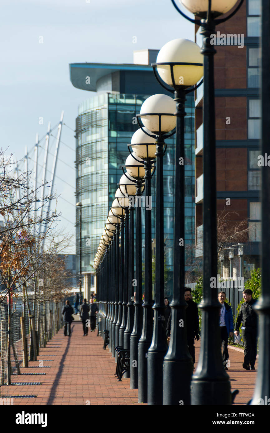 Street lamps at Huron Basin, Salford Quays, Manchester, England, UK.  MediaCityUK buildings behind. Stock Photo