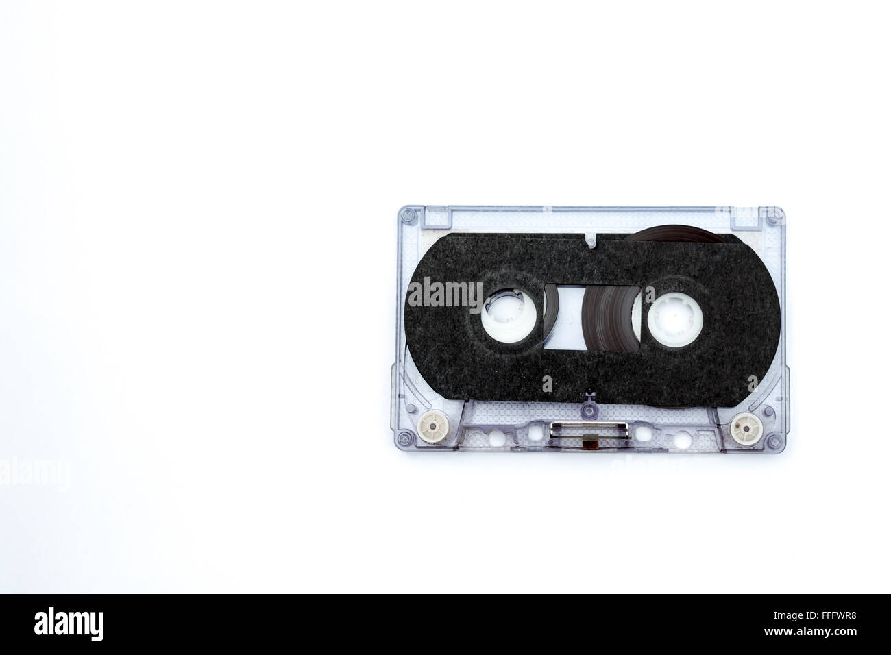 unrolled music cassette on an white background Stock Photo
