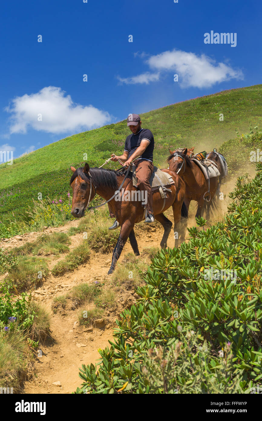 Horseback riding, Valley of seven lakes, Caucasus mountains, Abkhazia, Georgia Stock Photo