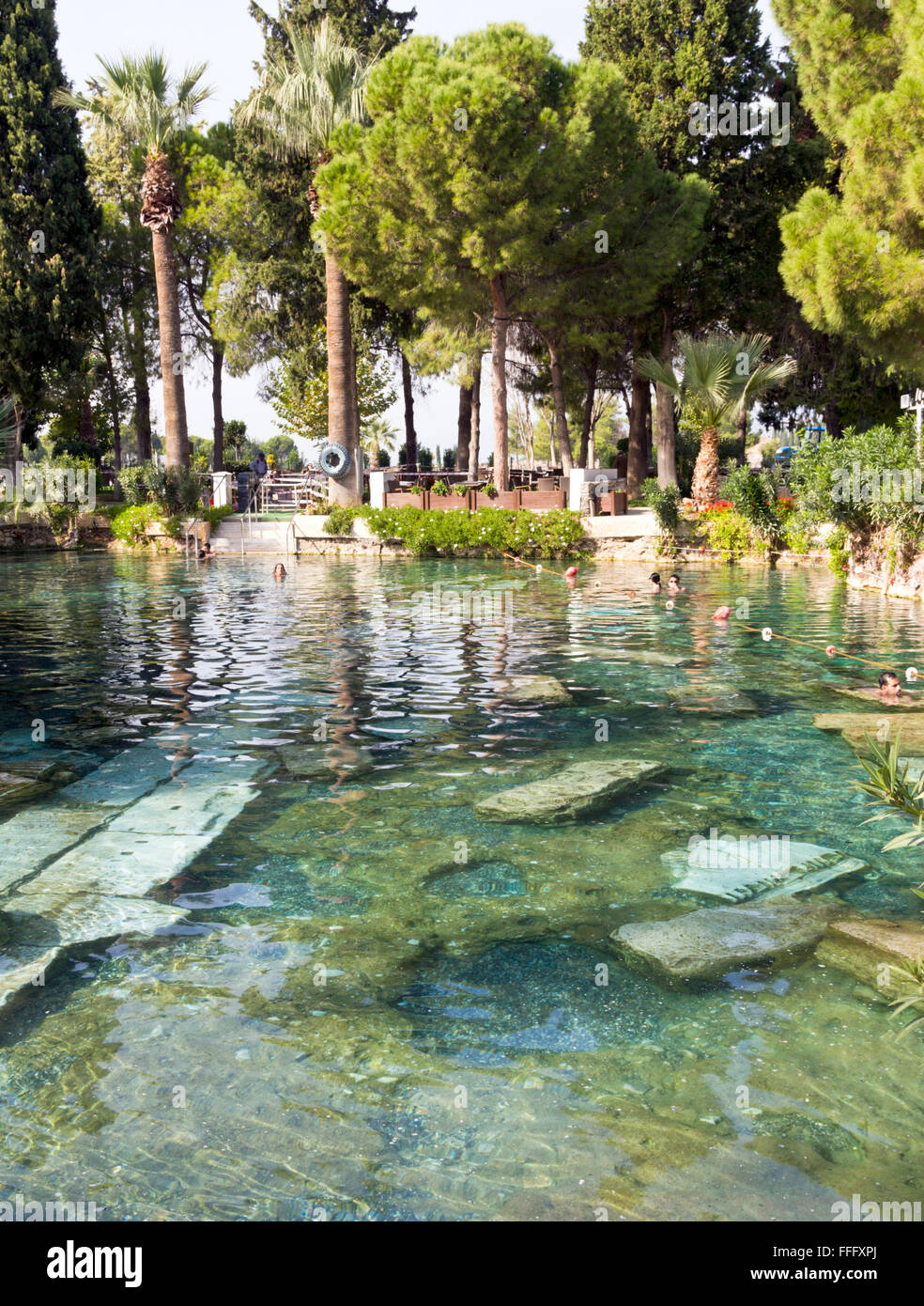 In the hot springs of ancient Roman ruins of Hieropolis at Pamukkale ...