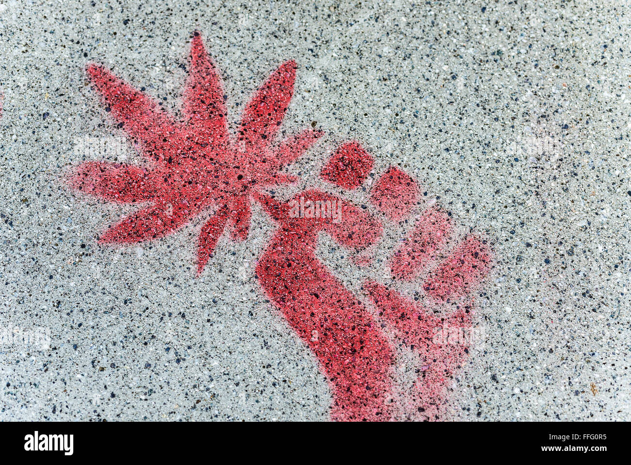 Marijuana graffiti drawn on a wall with red spray paint Stock Photo