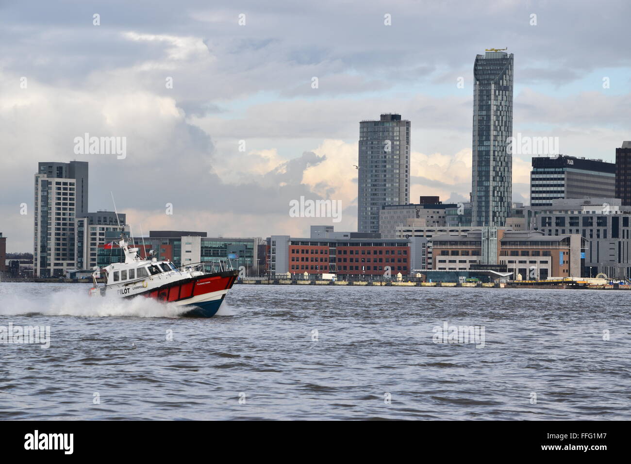 Liverpool Pilot boat with the Liverpool Waterfront behind Stock Photo