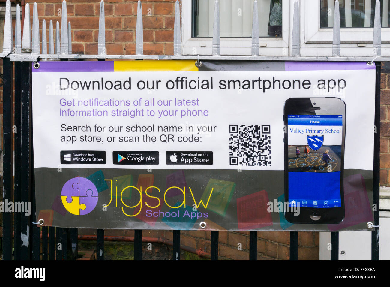 A Banner Outside A Primary School Encourages Parents To Download A