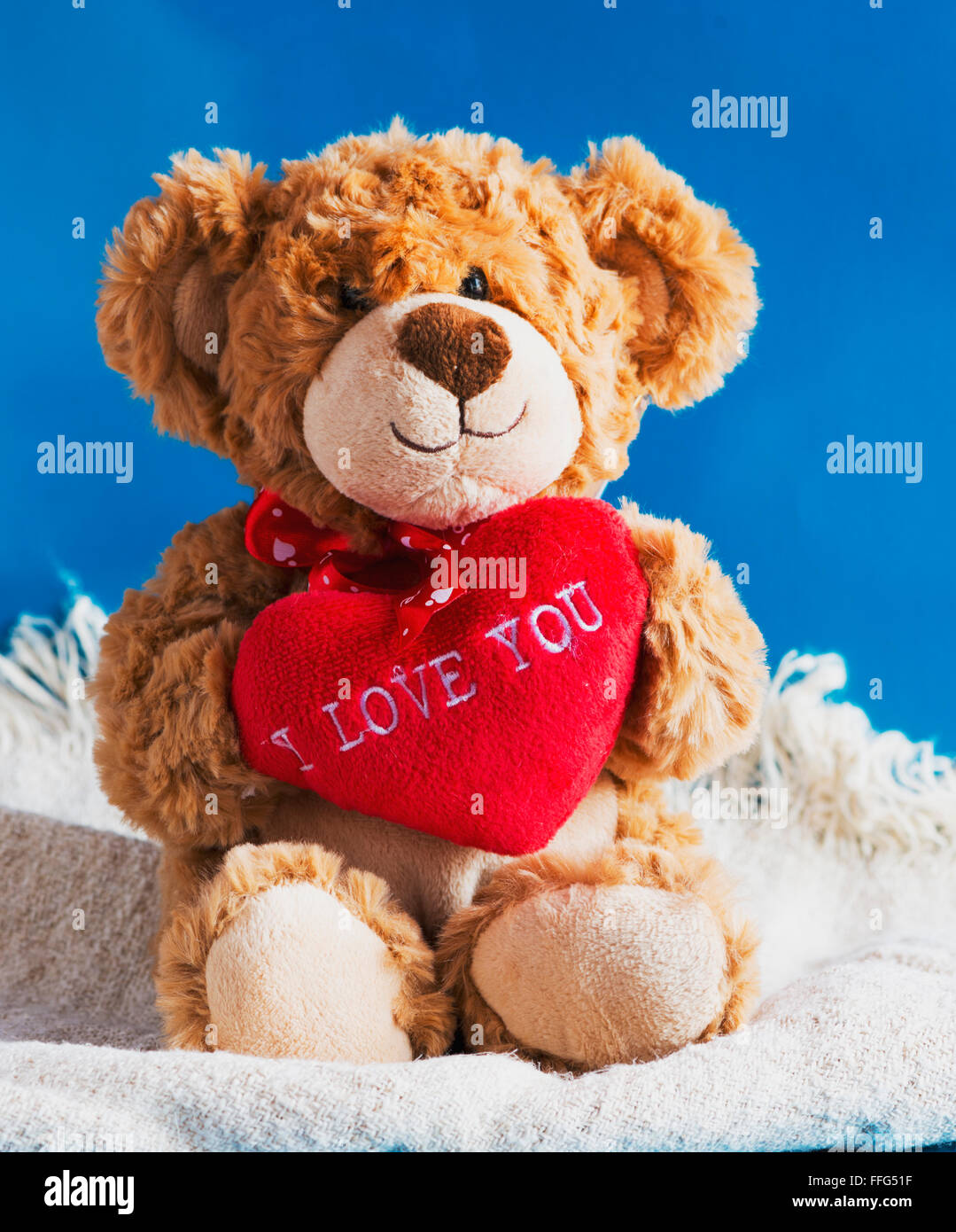 Teddy bear and big red heart with text 'I Love You' Stock Photo