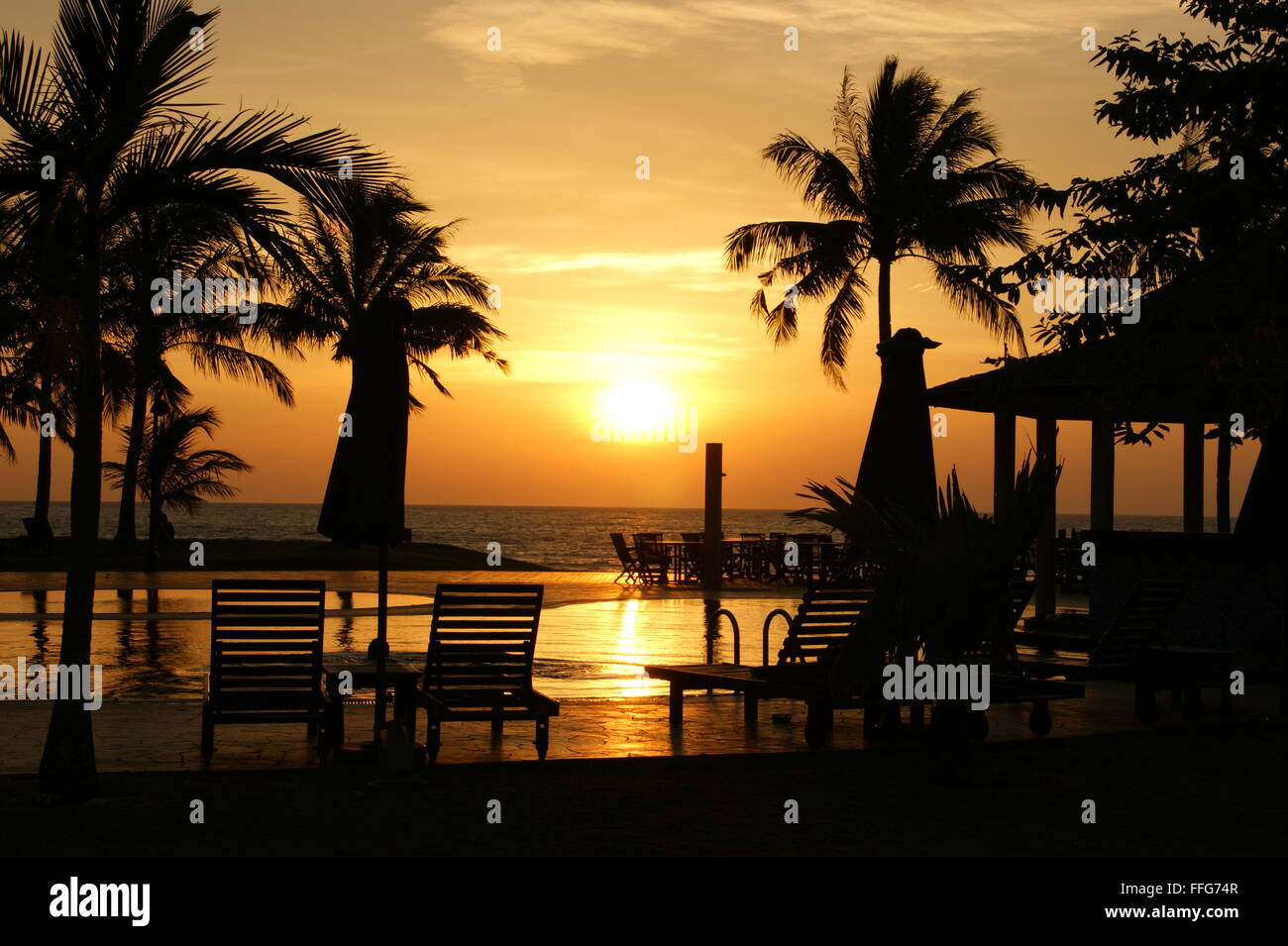 Tropical Sunset. Sunset on beach in tropical resort. Romance Borneo. Stock Photo