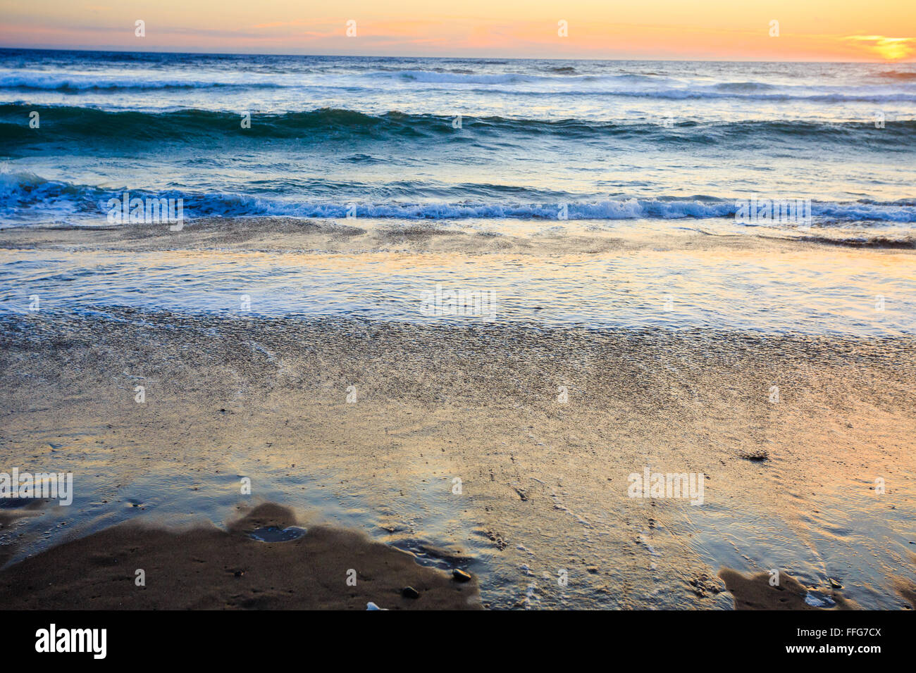 Beautiful sunset waves on beach hi-res stock photography and images - Alamy